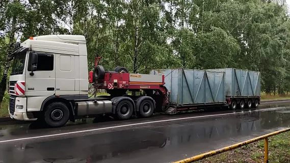 перевозка строительной техники тралом фото
