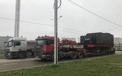 перевозка негабаритной строительной техники фото